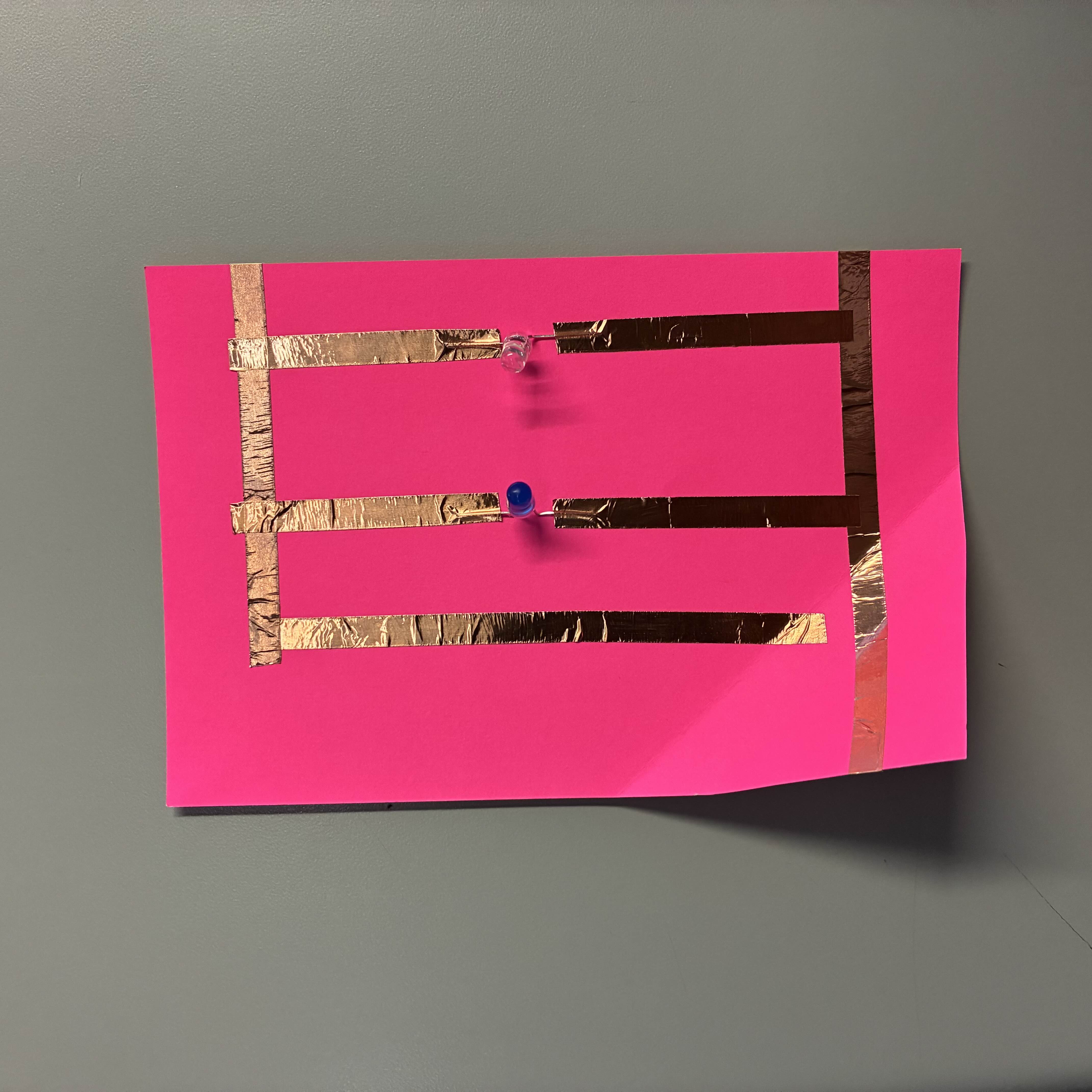 This is my parallel circuit, I made an attempt to place the copper tape straighter and more neatly compared to my previous circuits. I also lined up the fold properly so it wasn't such a struggle to put the battery in.