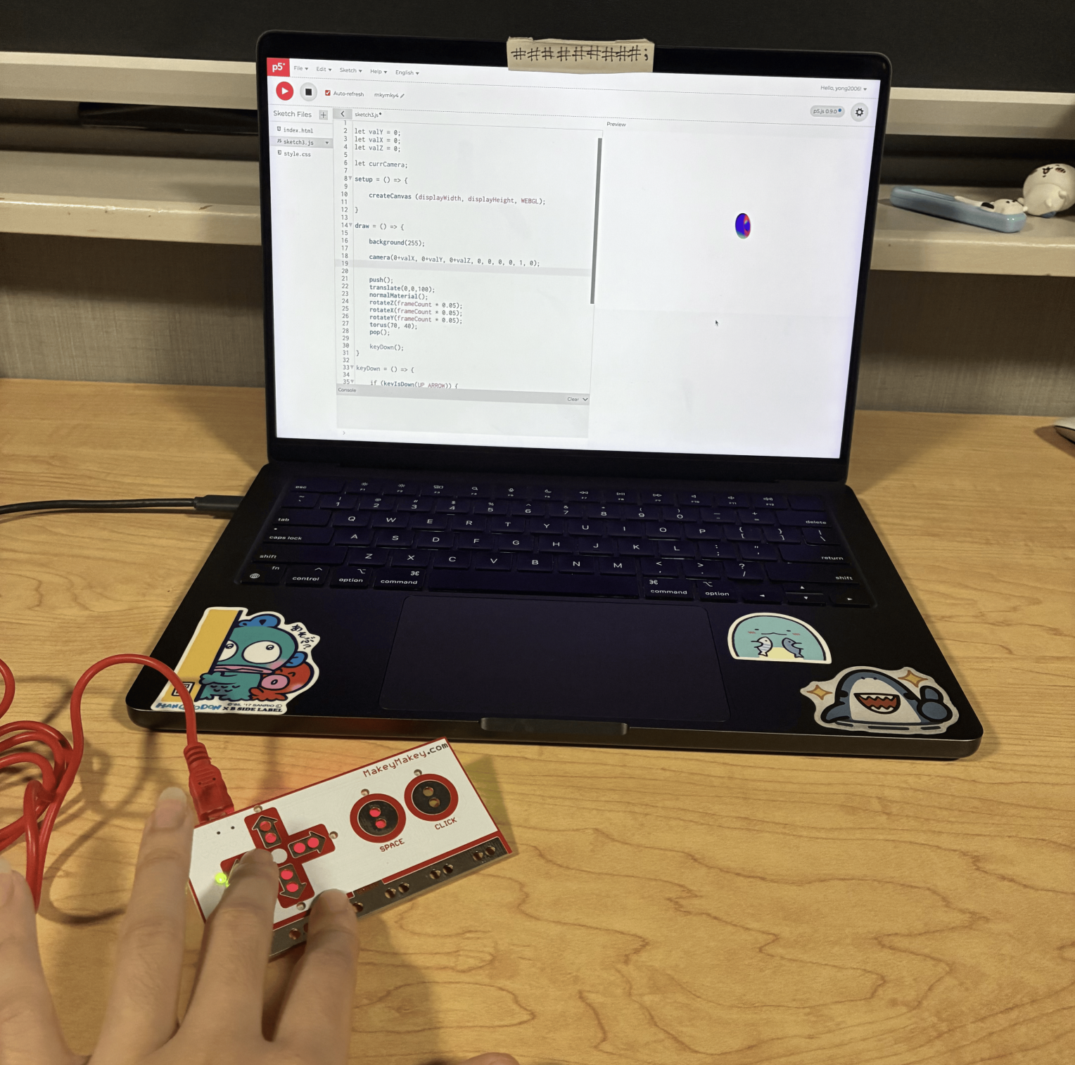 This was the third sketch where the user can change the direction that the 3D torus spins by clicking the arrow buttons on the Makey Makey. This was me clicking the left arrow on the Makey Makey to make the torus spin a different direction.